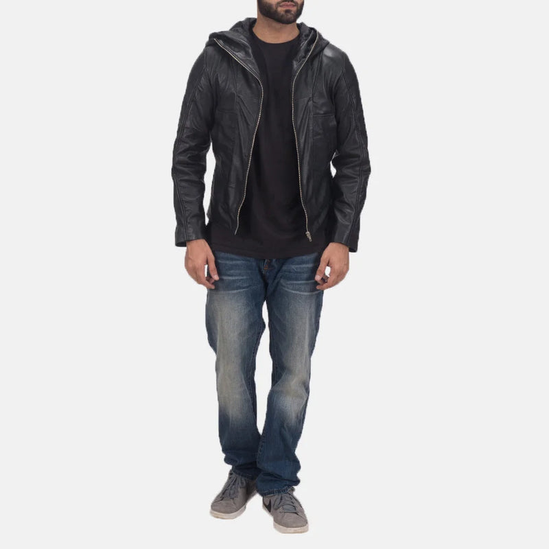 A fashionable man rocking a black quilted leather bomber jacket, adding an edgy touch to his ensemble.
