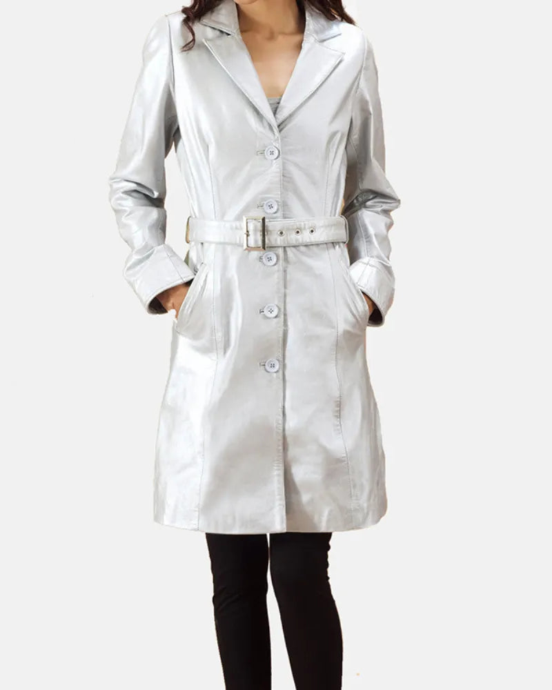 Woman in silver leather trench coat and black pants