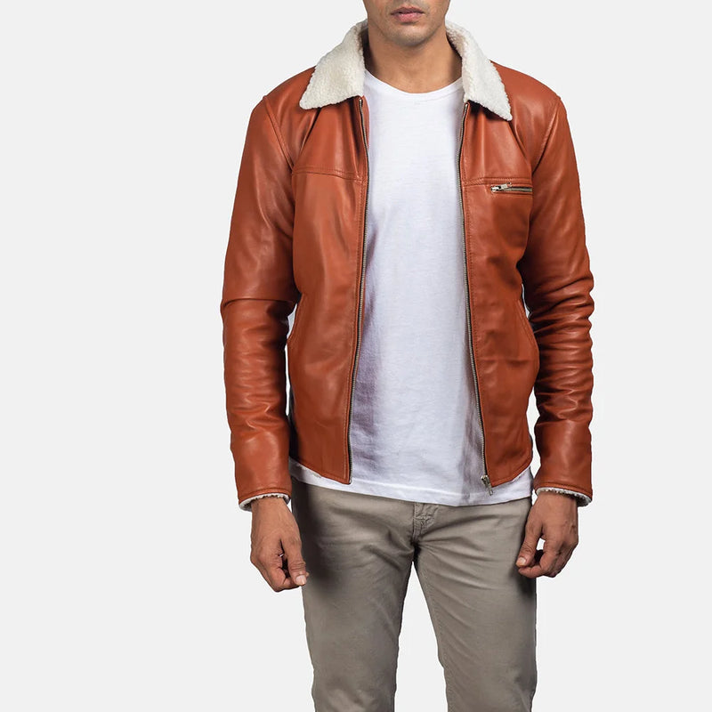 Handsome man wearing a tan suede leather jacket, looking effortlessly cool.