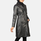 A gorgeous woman with a leather trench coat black exudes confidence and grace.