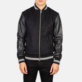 A stylish black striped varsity bomber jacket with a zipper and a collar, perfect for adding a touch of coolness to any outfit.