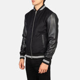 A stylish black striped varsity bomber jacket with a zipper and a collar, perfect for adding a touch of coolness to any outfit.