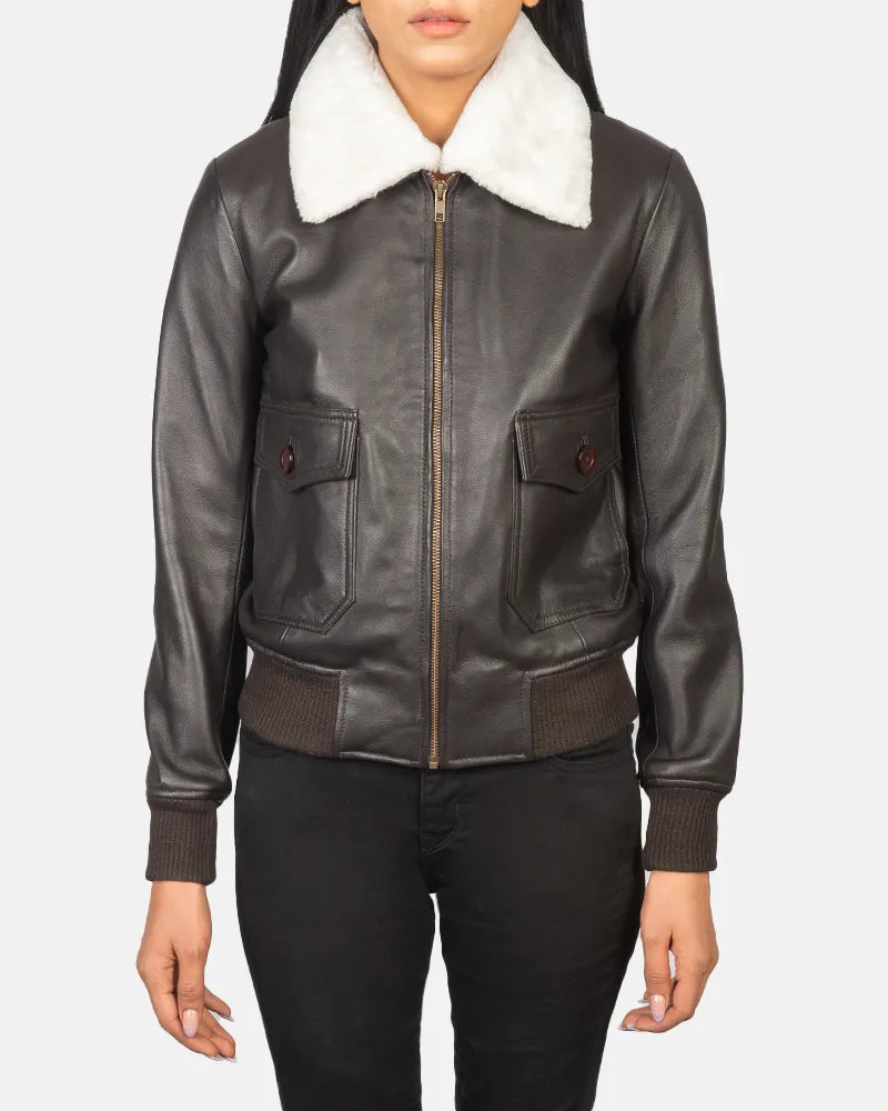 Fashionable women's leather style jacket featuring collar and cuffs.