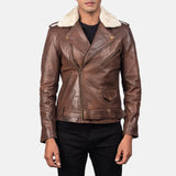 A stylish brown leather motorcycle jacket with a cozy shearling collar, perfect for adding a touch of rugged sophistication to any outfit.