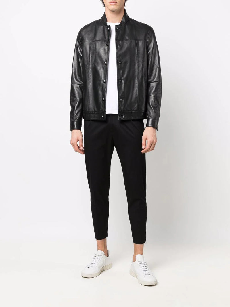 Showcasing trendy black leather shirt jacket and pants.