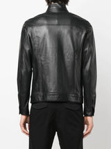 Showcasing trendy black leather shirt jacket and pants.